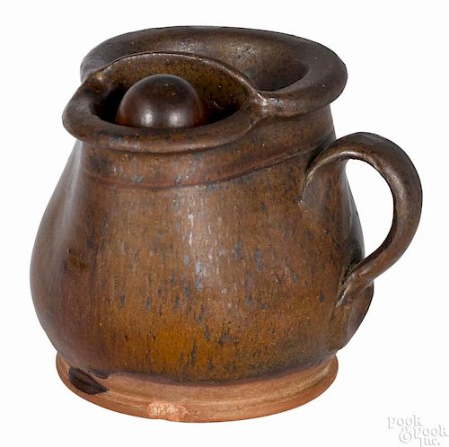 Redware shaving mug, 19th c., probably Pennsylvania, with speckled manganese decoration, 4 1/4'' h.