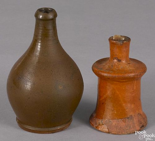 Two redware bottles, 19th c., 7'' h., and 5 1/4'' h.
