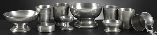 Pewter tablewares, 19th c., to include beakers, a salt, a dresser box, etc.