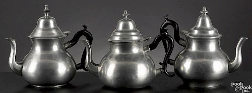 Three New England pear-shaped pewter teapots, early/mid 19th c., 7'' h.