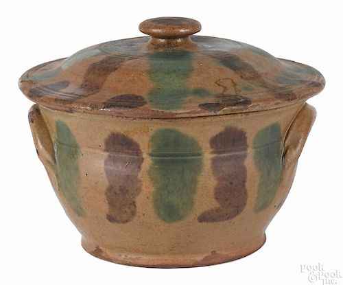Pennsylvania redware bowl and cover, 19th c., with green and brown stripes on a tan/orange ground