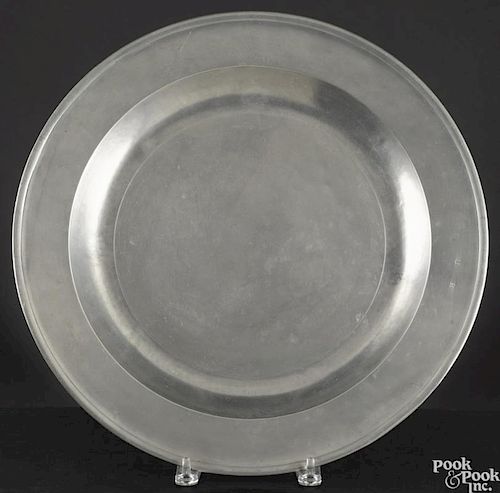 English pewter platter, 19th c., 17'' l., 22 1/4'' w., together with a charger, 16 1/2'' dia.