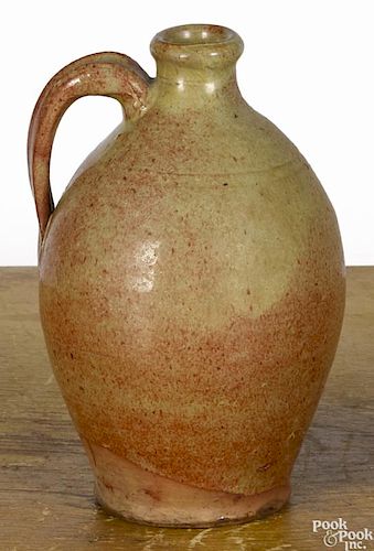 Maine redware jug, 19th c., with green and iron red glaze, 6 1/2'' h.