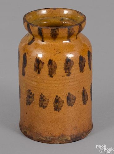 Pennsylvania redware jar, 19th c., with rows of manganese splotches on an orange ground, 6 1/2'' h.