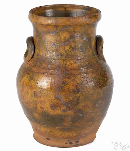 Pennsylvania redware vase, early 19th c., with a mottled green glaze and applied oval handles