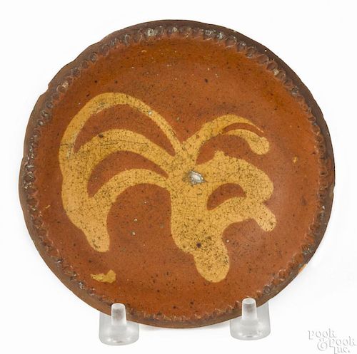 Pennsylvania redware cup plate, 19th c., with yellow slip decoration, 4 3/4'' dia.