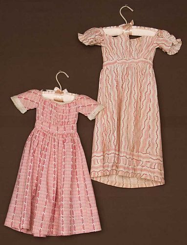 TWO PINK TODDLERS' DRESSES, 1820-1840