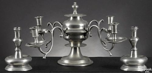 Continental pewter four-arm candelabra, 19th c., together with a pair of candlesticks, 8 1/2'' h.