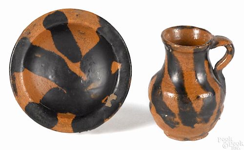 Miniature Pennsylvania redware pitcher and basin, 19th c., with manganese streaks, 2 3/4'' h.