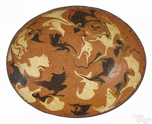Connecticut redware oval loaf dish, early 19th c., with cream and brown marbled slip decoration