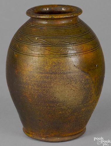 Pennsylvania redware jar, early 19th c., with incised squiggle bands around shoulder