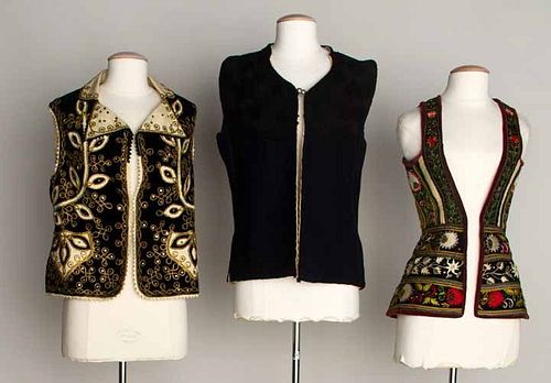 THREE LONG EMBROIDERED FOLK VESTS, 1875-1925