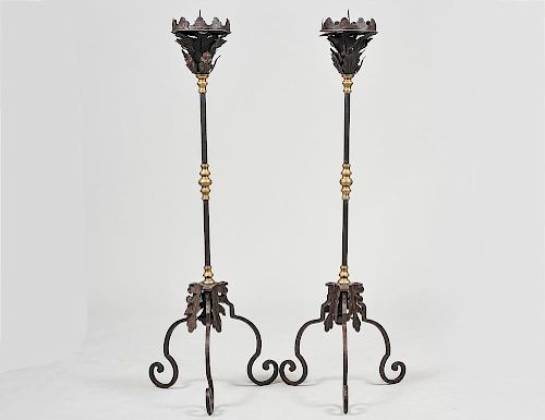 PAIR OF RENAISSANCE STYLE WROUGHT IRON AND BRASS TORCHIERES