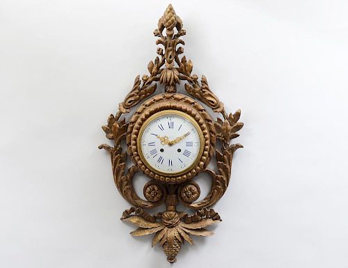 LOUIS XVI STYLE CARVED AND GILTWOOD CARTEL CLOCK