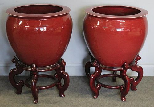 Pair of Sang De Boeuf Style Vases on Stands.