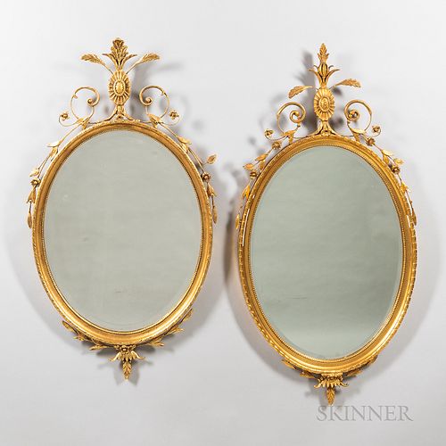 Two Neoclassical Oval Gilt-wood and Gilt-gesso Mirrors