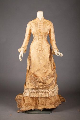 GOLD BROCADE BUSTLE DRESS, 1870s