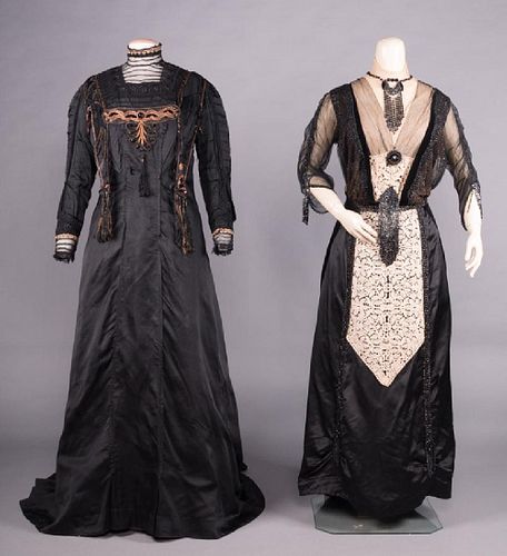 TWO TRAINED BLACK DRESSES, EARLY 20TH C