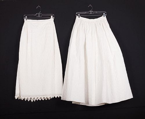 2 WHITE COTTON QUILTED PETTICOATS, MID 19TH C