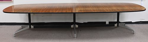 Charles and Ray Eames Dining Table, having 12' rosewood oval top on triple foot base, for Herman Miller Aluminum, group table, height 28 inches, top 5