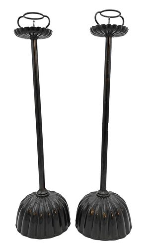 Pair of Japanese Brass Pricketts, painted black with scalloped bobeche, cylindrical body and ribbed base, height 26 inches,
