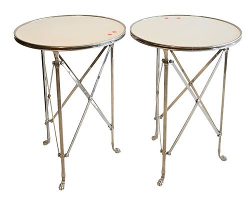 Pair of French Directoire Style Gueridon Style Side Tables, having inset marble top set on X metal bases,
ending in paw feet, height 27 inches, top di