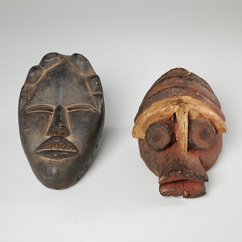 (2) African carved wood maskettes