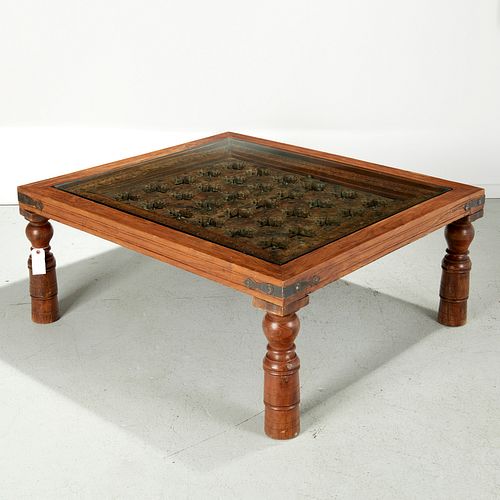 Indian carved iron studded teakwood coffee table
