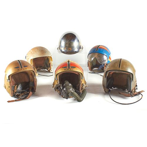 Five Vintage Navy Flight Helmets and One Chrome Parade Helmet