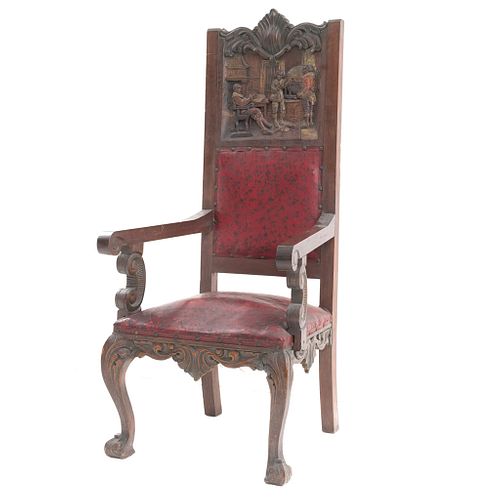 Sillón. España, SXX. Elaborado en madera. Con tapicería de piel color rojo Respaldo cerrado, asiento acojinado y soportes semicurvos.