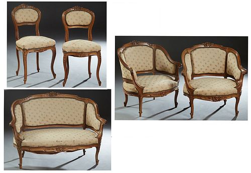 French Louis XV Carved Walnut Five Piece Parlor Suite, late 19th c., consisting of a love seat, two bergeres, and two side chairs, the shell carved cr