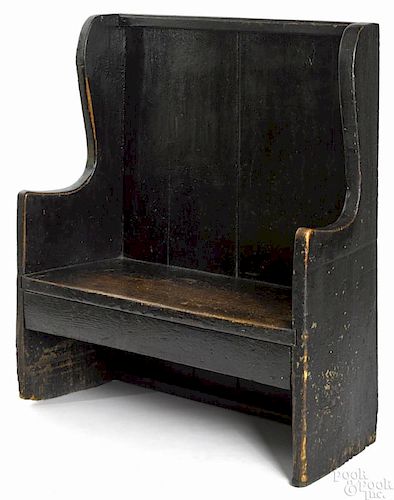 Diminutive painted oak settle, 18th c., retaining an old black surface, 45 1/2'' h., 42'' w.