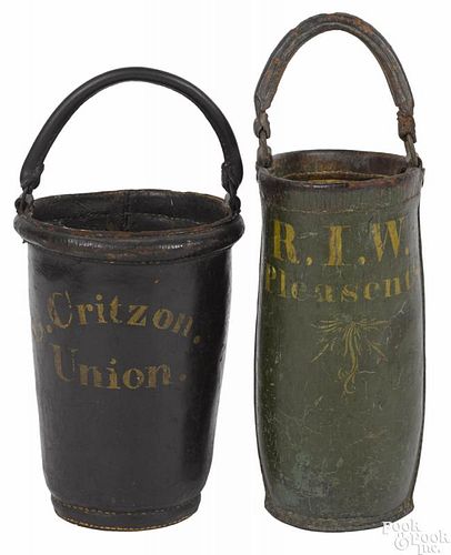 Two painted leather fire buckets, 19th c., inscribed R. I. W. Pleasant St. and G. Critzon.