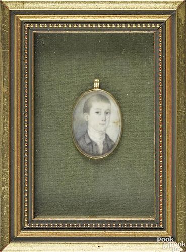 Miniature watercolor on ivory portrait locket of a boy, early 19th c., 1'' x 3/4''.