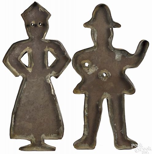 Pair of tinned sheet iron cookie cutters, 19th c., of a man and woman, 14 1/4'' h. and 14 1/2'' h.