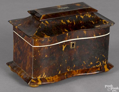 Regency tortoiseshell tea caddy, early 19th c., with a sarcophagus serpentine front top