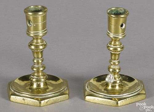Pair of brass octagonal base taperstick holders, early 18th c., 2 5/8'' h.