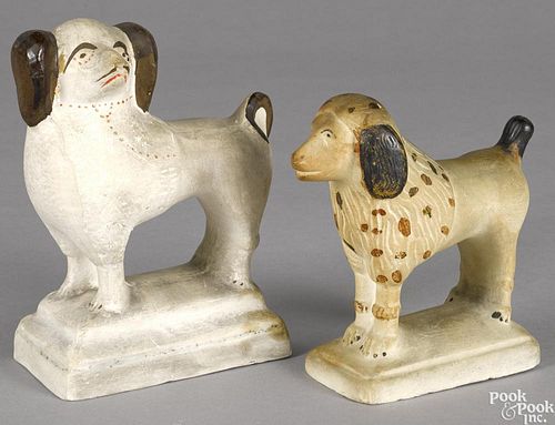 Two Pennsylvania chalkware spaniels, 19th c., 6'' h. and 7 1/2'' h.