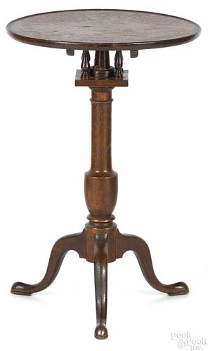 Pennsylvania walnut candlestand, ca. 1800, with a birdcage and urn turned standard