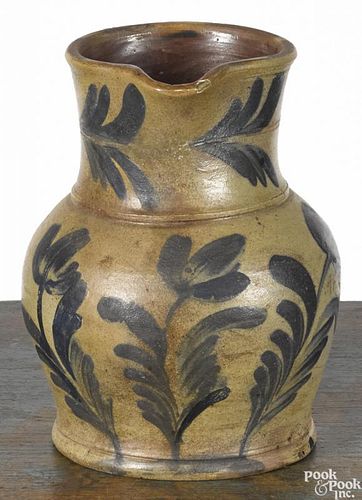 Pennsylvania Remmey type stoneware pitcher, 19th c., with cobalt tulip decoration, 8 1/2'' h.