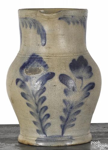 Pennsylvania Remmey type stoneware pitcher, 19th c., with cobalt tulip decoration, 9'' h.