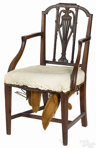 Philadelphia Federal mahogany armchair, ca. 1800, with a carved back and stretcher base.