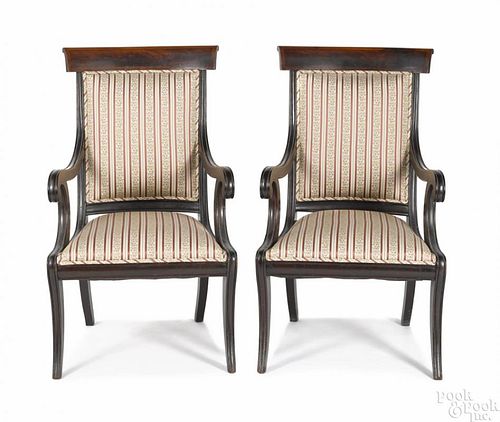 Pair of classical mahogany saber leg armchairs, ca. 1835.