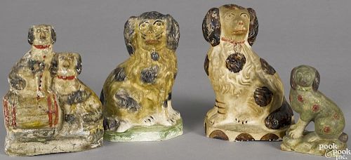 Three Pennsylvania chalkware spaniels, 19th c., together with two spaniels and a barrel group