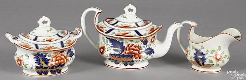 Gaudy Dutch three-piece tea service, 19th c., in the warbonnet pattern, to include a teapot, 6'' h.