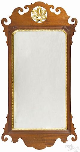 Chippendale mahogany and parcel gilt looking glass, late 18th c., with a plume carved crest