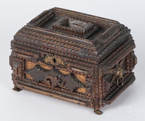 Tramp art carved alms box, 19th/20th c., with applied metal lion mask handles and feet