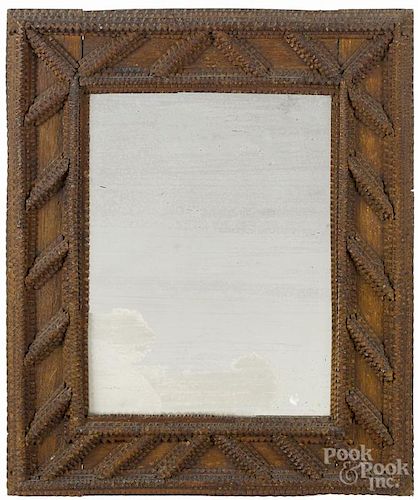 Tramp art carved mirror, early 20th c., 18'' x 15''.