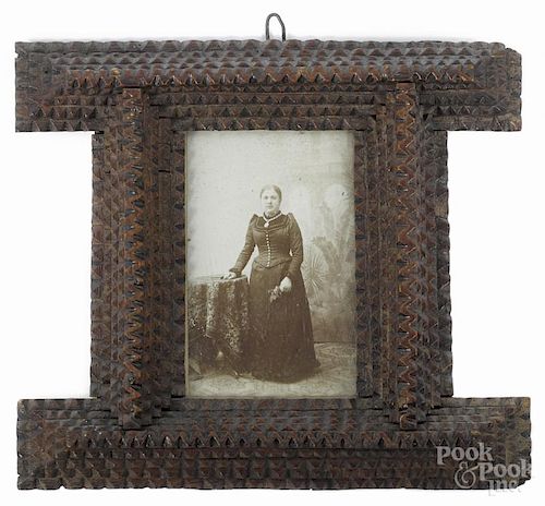 Tramp art carved frame, ca. 1900, with five tightly carved tiers, 5 3/4'' x 6 1/2''.