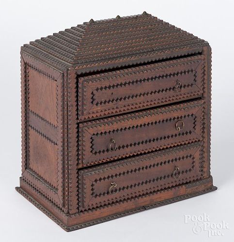 Tramp art carved miniature three-drawer chest, ca. 1900, 10 1/2'' h., 10'' w.